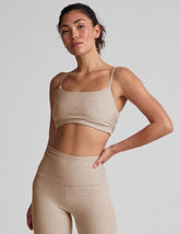 brown bra with shirred detailing on the sides and adjustable straps.